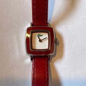Lacoste watch with red leather band.